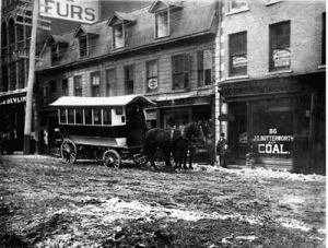 Sparks Street between Metcalfe and Elgin Streets, c. 1877. Notice the wooden sidewalk set lower than the roadway.