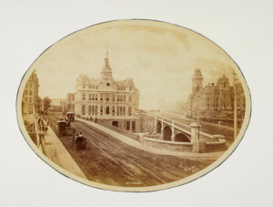 Sappers’ Bridge (left) and Dufferin Bridge (right), c. 1878, The old Post Office is in the centre of the photograph. Notice the horse-drawn passenger railway in operation on Sappers’ Bridge.