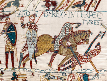 Detail from the Bayeux Tapestry, circa 1070, showing the death of the Anglo-Saxon King Harold. The Latin inscription reads Harold Rex Interfectvs est, meaning King Harold is slain. 