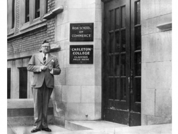 Maxwell MacOrdum, president 1947-55, at the entrance to the High School of Commerce (now Glebe Collegiate), where the first evening classes were held.